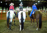 Rebecca Osgood, Brenna Brawner and Kayte Beckelheimer smile for the camera